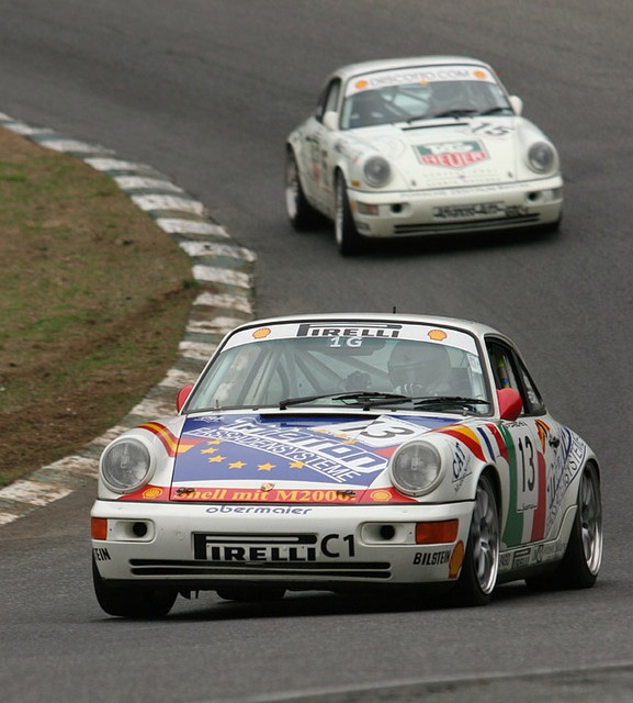 White Porsche 964 Cup car, number 13, leading another 964 through a corner